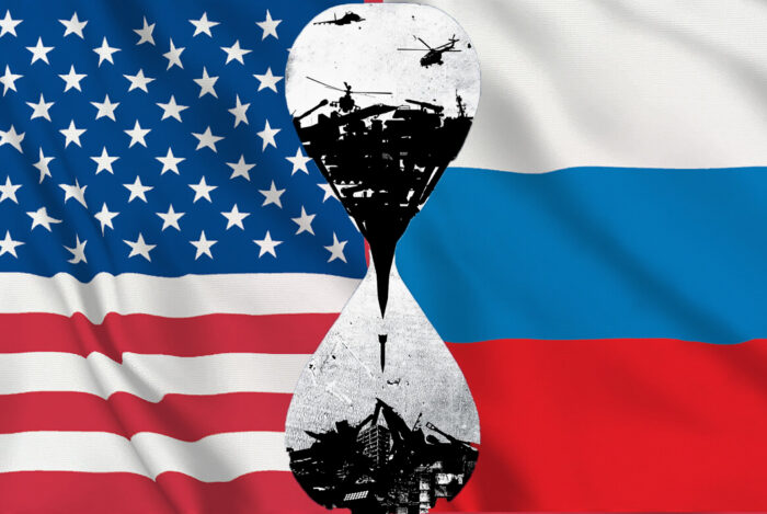 Bandiere Usa e Russia con clessidra. Foreign Affairs: Washington necessita di un endgame in Ucraina